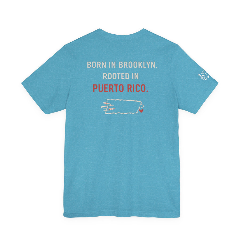 De Aquí, De Allá Tee — Born in Brooklyn Rooted in Puerto Rico T‑Shirt