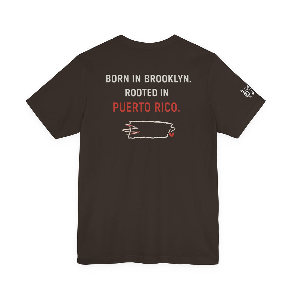 De Aquí, De Allá Tee — Born in Brooklyn Rooted in Puerto Rico T‑Shirt