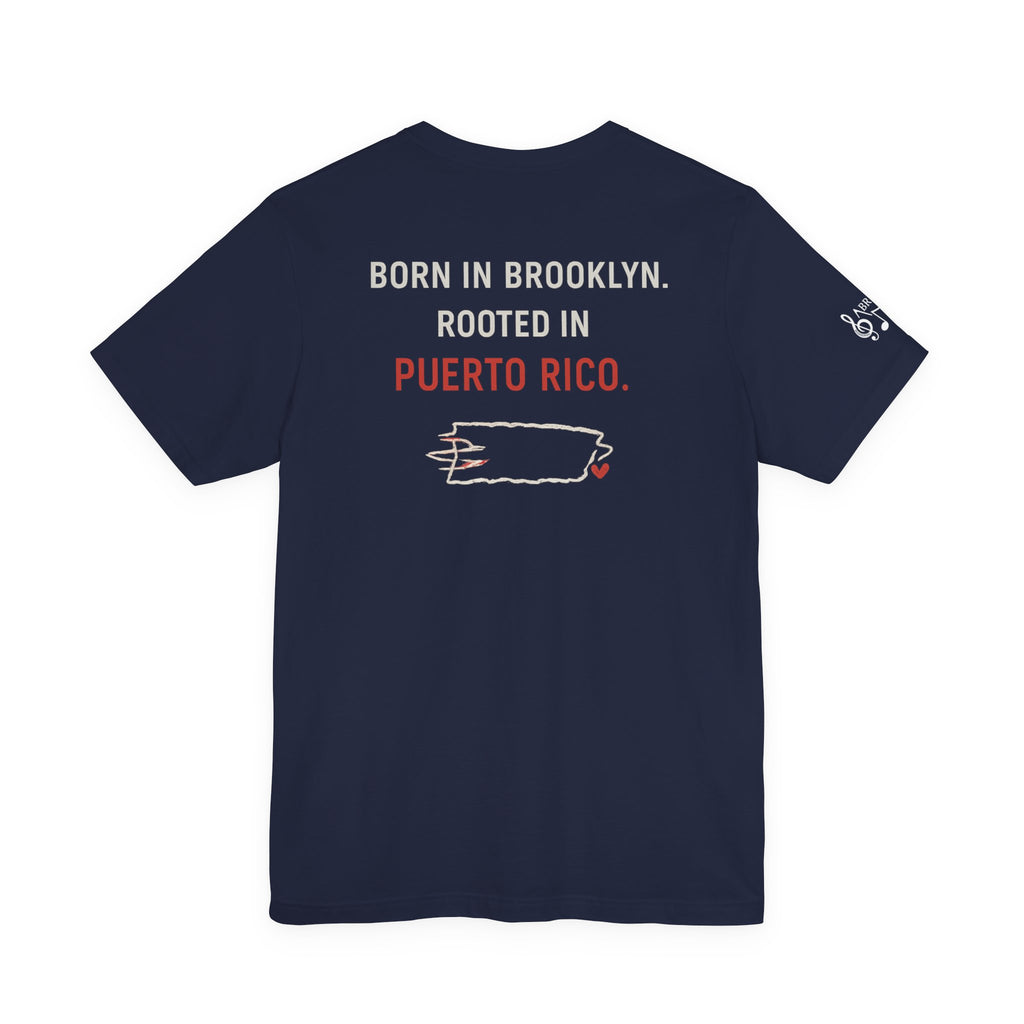 De Aquí, De Allá Tee — Born in Brooklyn Rooted in Puerto Rico T‑Shirt