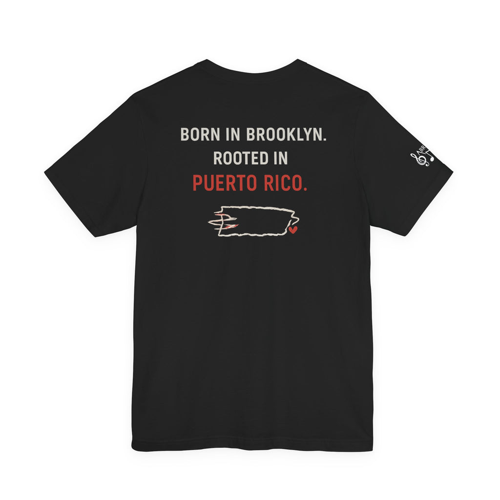 De Aquí, De Allá Tee — Born in Brooklyn Rooted in Puerto Rico T‑Shirt