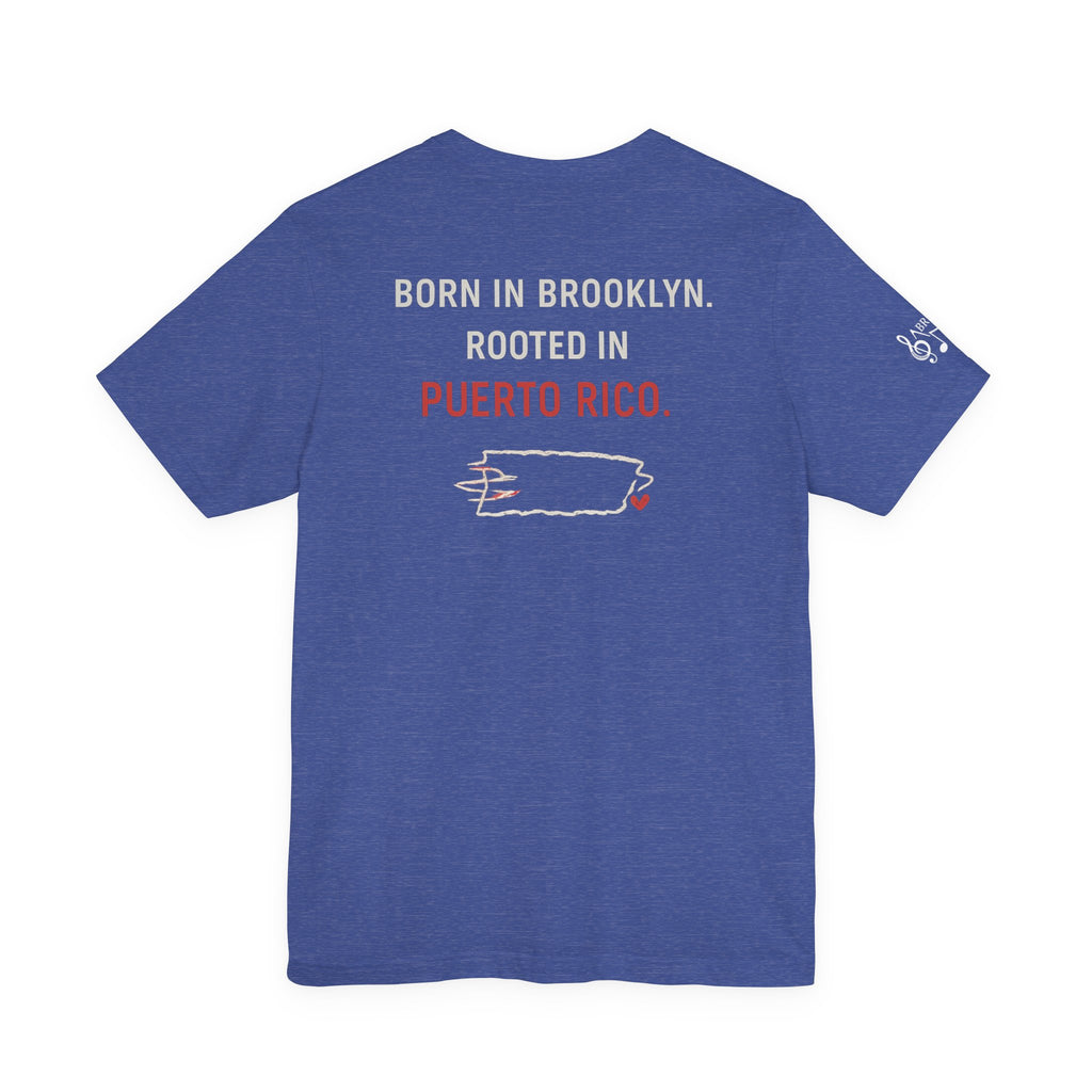 De Aquí, De Allá Tee — Born in Brooklyn Rooted in Puerto Rico T‑Shirt